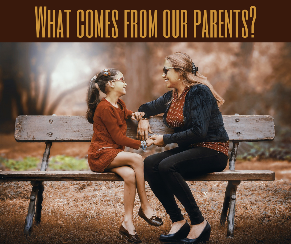 Mother and daughter sitting on bench